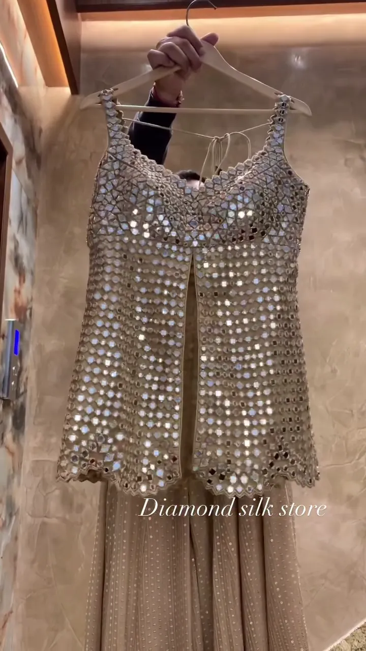 Champagne Mirror‑Work Sleeveless Long Top with Front Slit and Coordinated Flowing Skirt Contemporary Festive Set