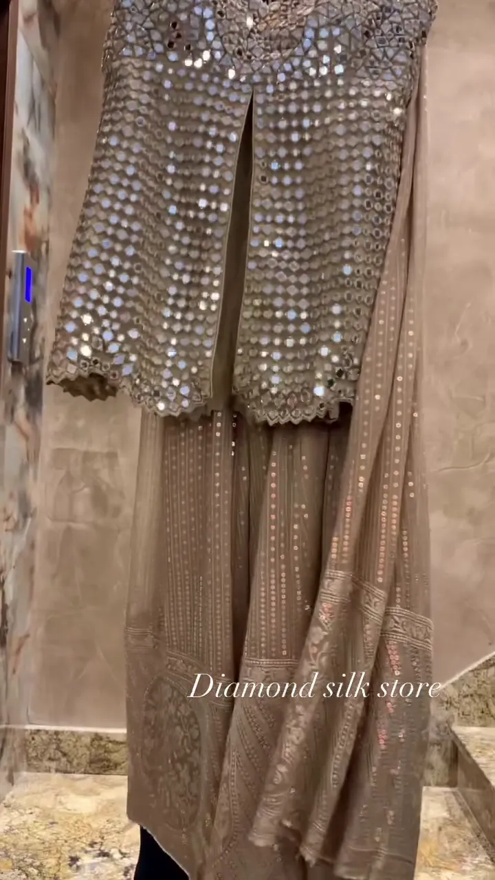 Champagne Mirror‑Work Sleeveless Long Top with Front Slit and Coordinated Flowing Skirt Contemporary Festive Set