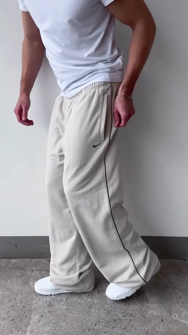 Off‑White Relaxed Wide‑Leg Track Pants with Elastic Waist and Black Side Piping for Athleisure & Lounge Wear