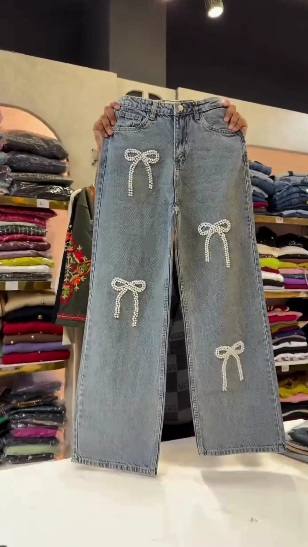 Light Blue High‑Rise Wide‑Leg Denim Jeans with All‑Over Pearl Bow Patch Detailing for Trendy Casual Wear